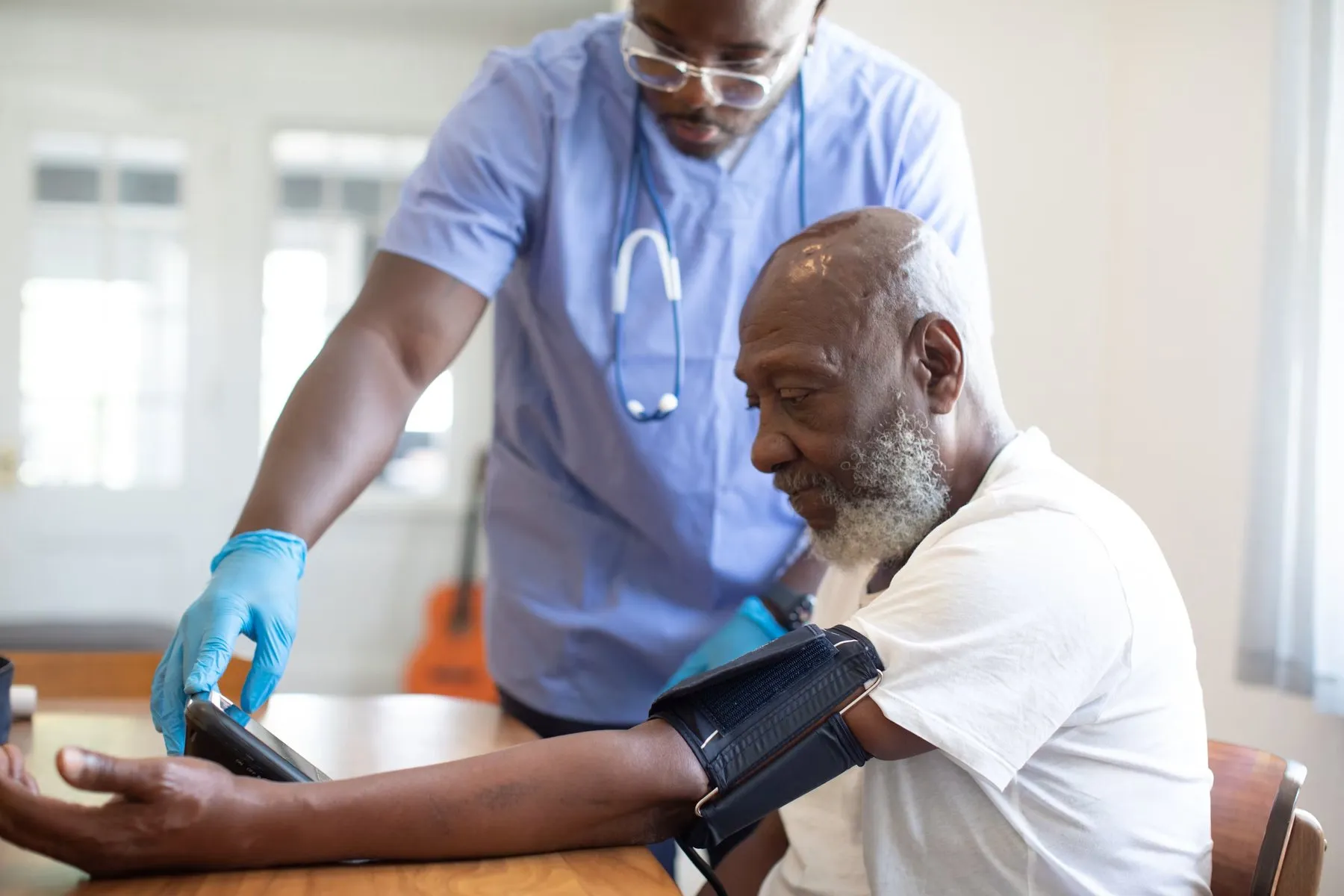 Clinician taking a patient's blood pressure